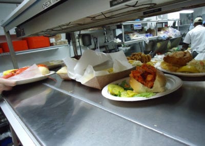 plates ready to be delivered at JT's Seafood kitchen counter