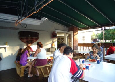 families dining outside at JT's Seafood Restaurant