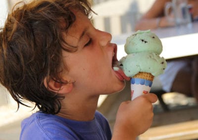 boy licking JT's Seafood ice cream cone